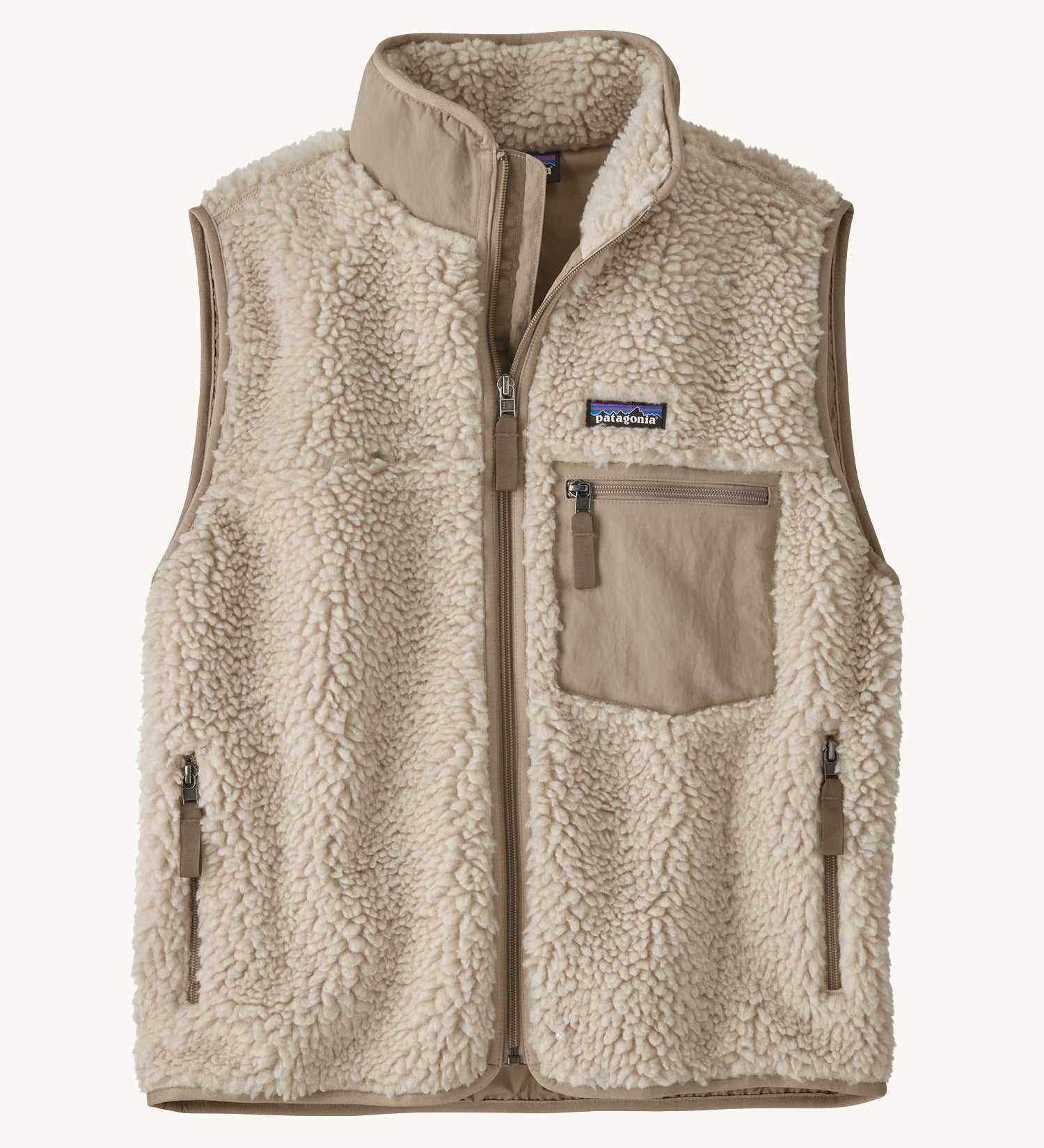 Patagonia thick fleece gilet. In cream with dark cream trim. Features a turned up collar with a zip from the neckline down with a cream patch pocket and side pockets