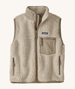 Patagonia thick fleece gilet. In cream with dark cream trim. Features a turned up collar with a zip from the neckline down with a cream patch pocket and side pockets