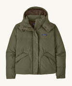 Patagonia women's hooded jacket in dark green. Features a full length front zip and popper fastener and side pockets