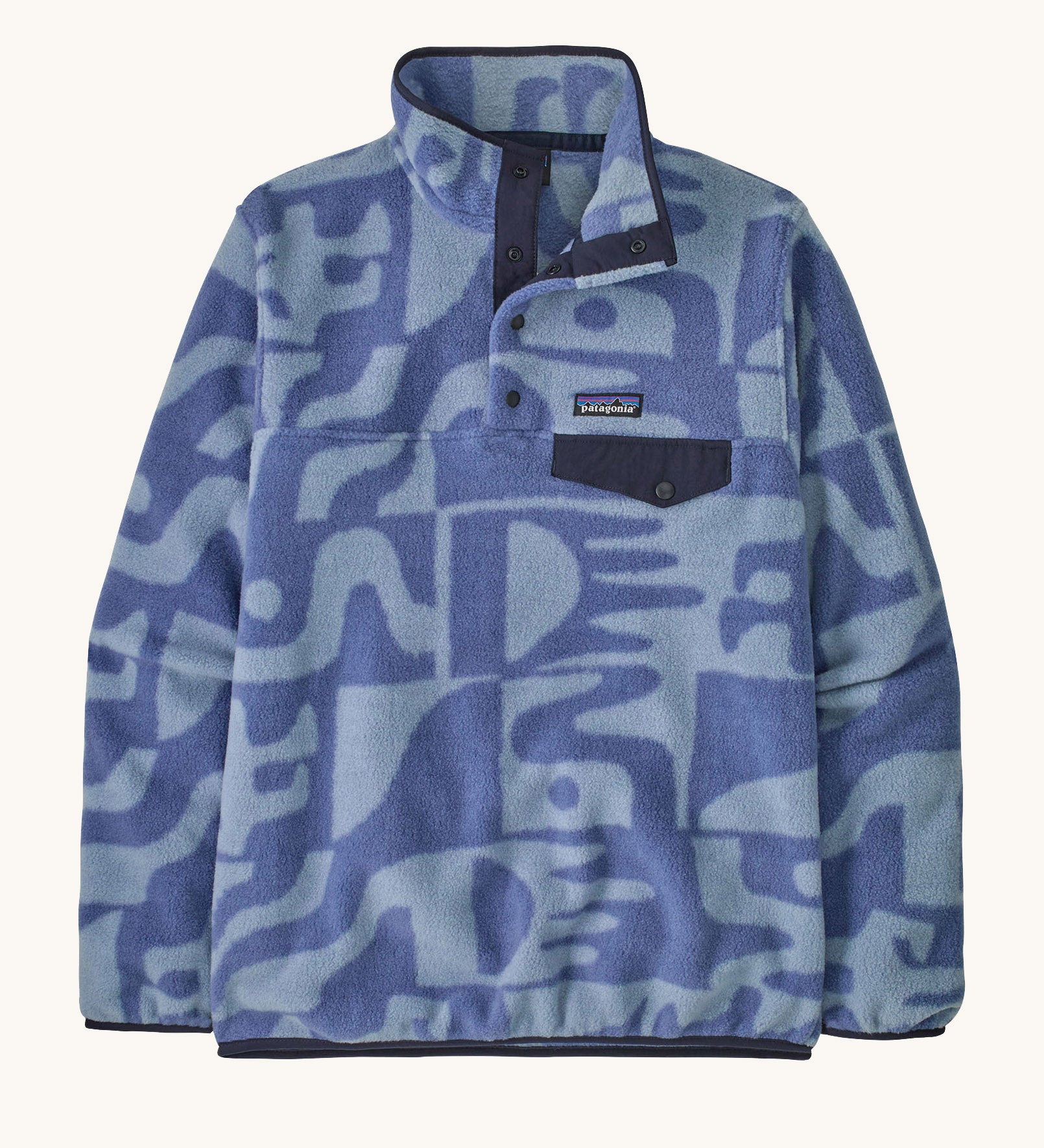 Patagonia women's lightweight fleece with light and dark blue retro patterns. Features a 1/4 length front poppers and a dark blue chest pocket.