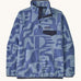 Patagonia women's lightweight fleece with light and dark blue retro patterns. Features a 1/4 length front poppers and a dark blue chest pocket.