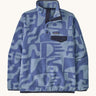 Patagonia women's lightweight fleece with light and dark blue retro patterns. Features a 1/4 length front poppers and a dark blue chest pocket.