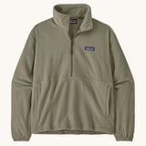 Patagonia women's lightweight fleece in dark green. Features a half length front zip and side pockets