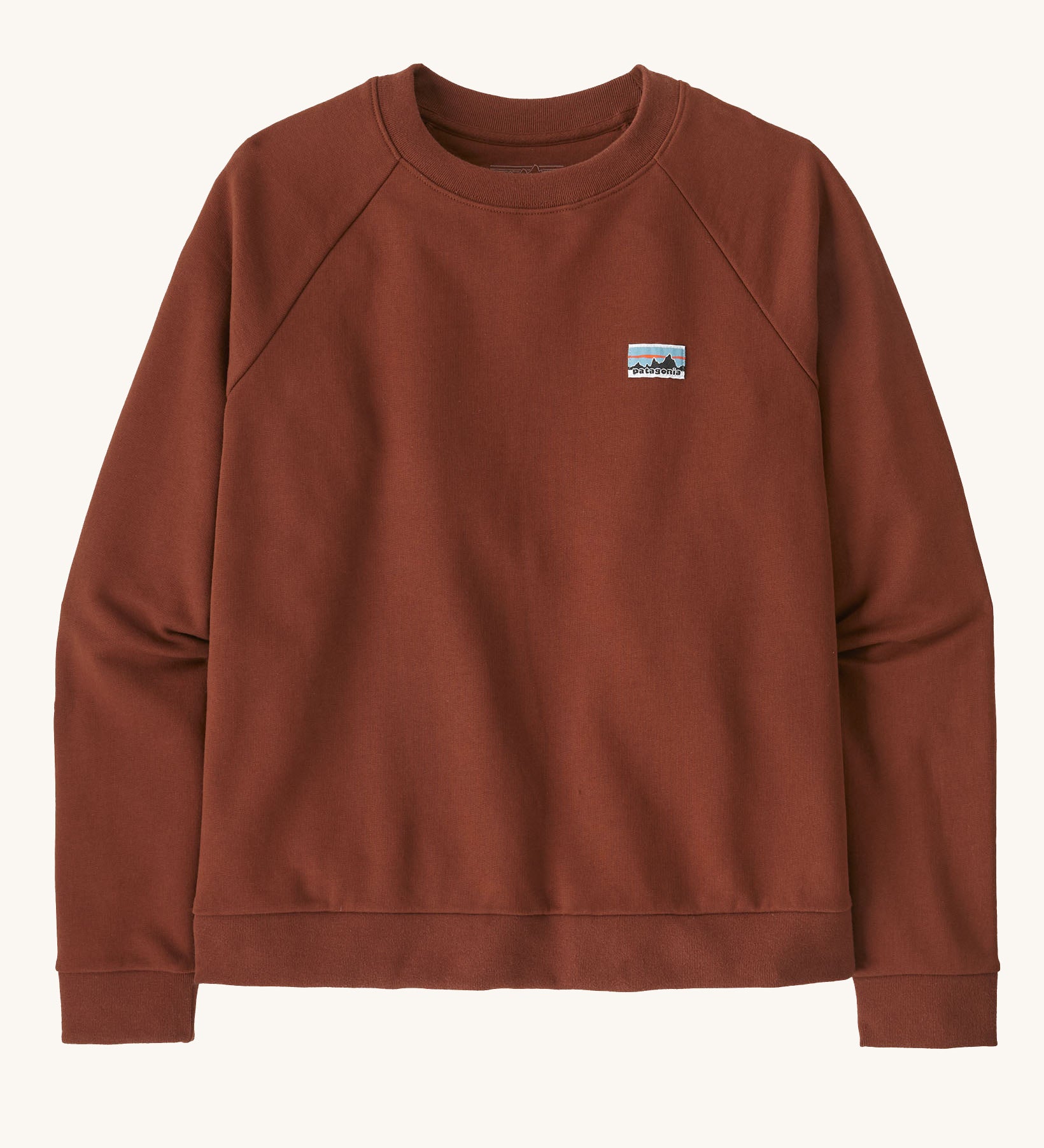 Patagonia women's organic cotton sweater in dark red with a small Patagonia patch on the chest