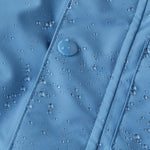 Water droplets on the fromt of the Patagonia Baby Snow Pile Bibs, showing how waterproof the Bibs are