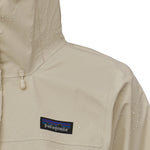 Raindrops are one the shoulder of the Patagonia Women's Torrentshell 3L Rain Jacket, showing the waterproof abilities of the jacket