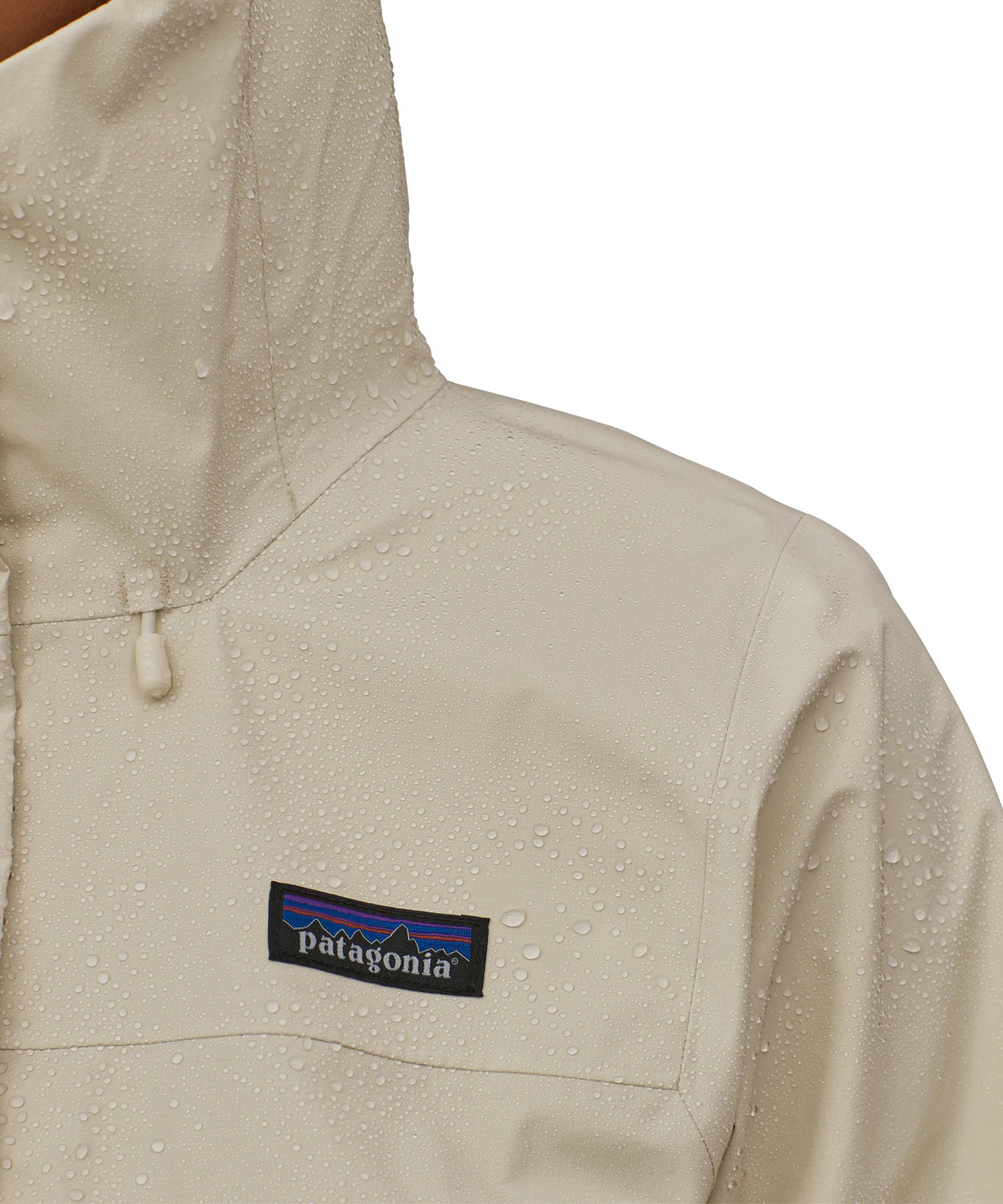 Raindrops are one the shoulder of the Patagonia Women's Torrentshell 3L Rain Jacket, showing the waterproof abilities of the jacket