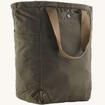 The back of the Patagonia Waxed Canvas Tote Pack Basin Green, showing the carry handle 