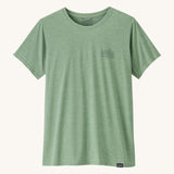 The front of the Patagonia Women's Capilene Cool Daily Graphic Shirt - Strataspire / Ellwood Green X-Dye available at Babipur. A pale green top with short sleeves and a brand name graphic on the chest.