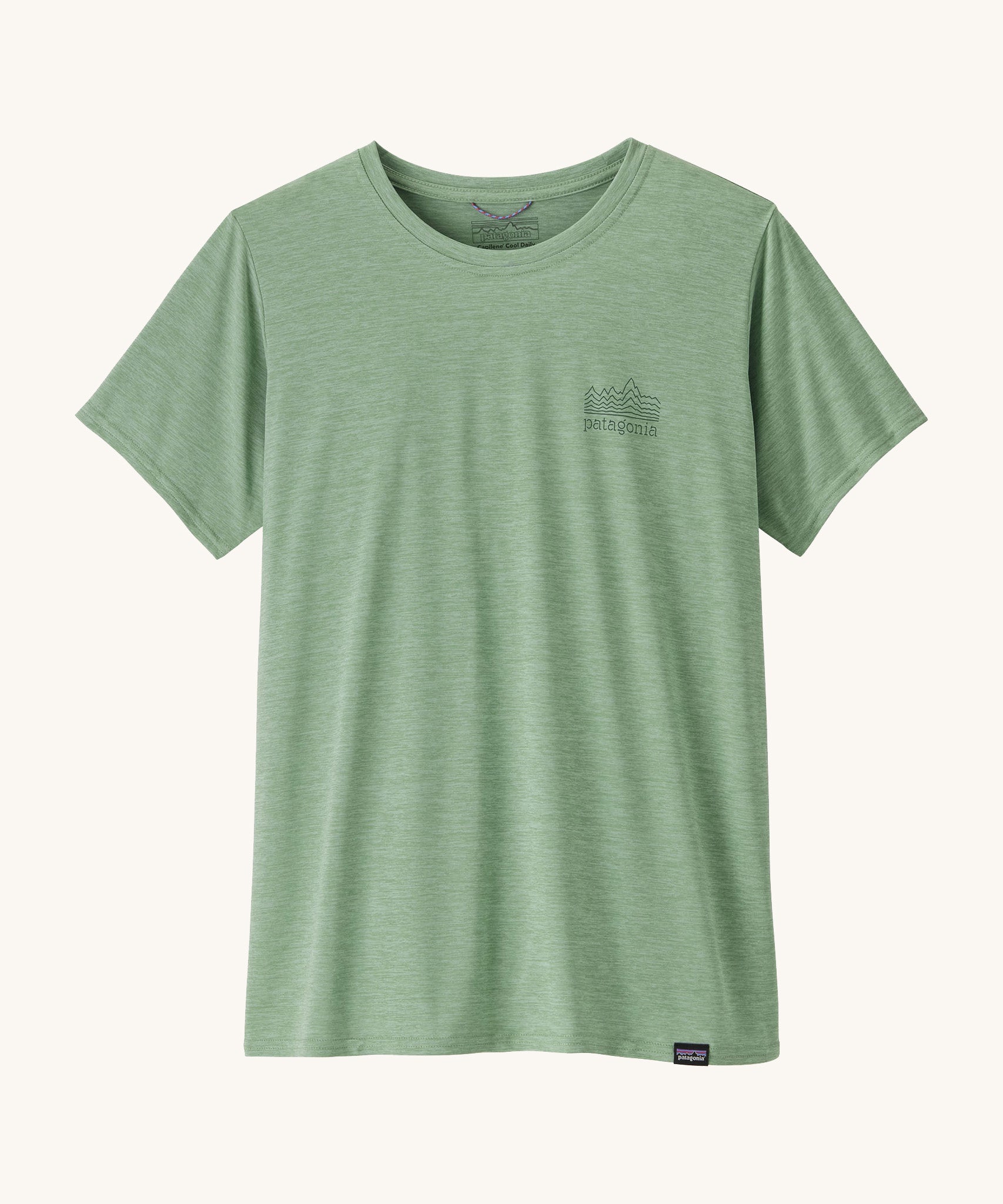The front of the Patagonia Women's Capilene Cool Daily Graphic Shirt - Strataspire / Ellwood Green X-Dye available at Babipur. A pale green top with short sleeves and a brand name graphic on the chest.