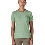 A woman wearing the Patagonia cool daily graphic short sleeve tshirt in ellwood  green with brand logo on the left chesr available at Babipur.