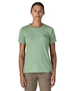 A woman wearing the Patagonia cool daily graphic short sleeve tshirt in ellwood  green with brand logo on the left chesr available at Babipur.