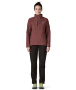 A woman wearing the Patagonia R2 crossstrata jacket in dark ruby available at Babipur. Features a full length zip, 2 side pockets and easy access chest pockets