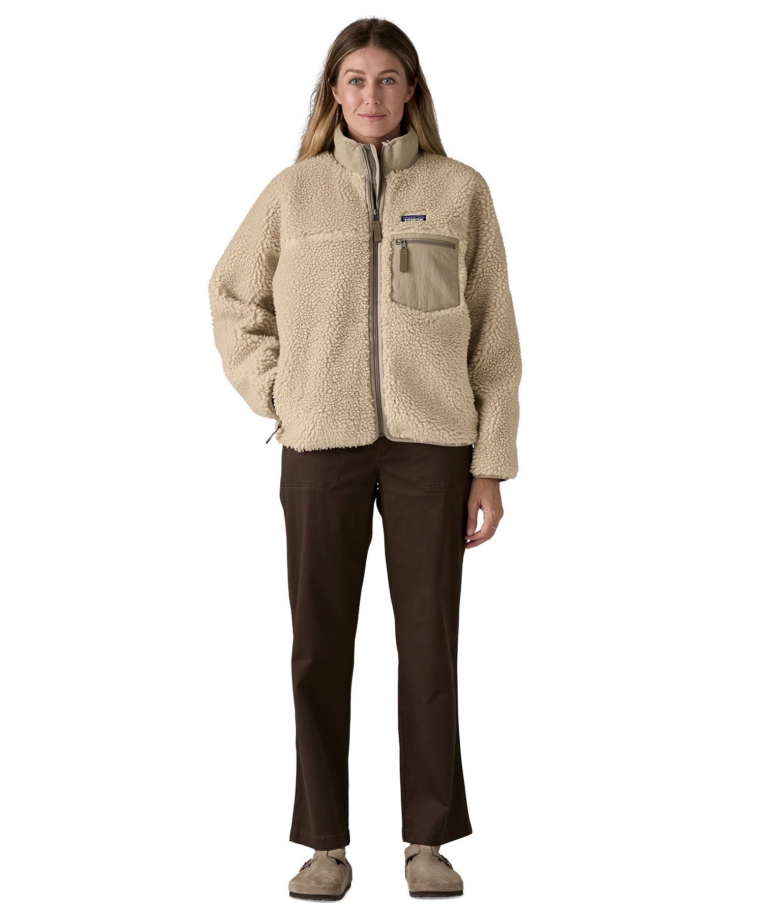 A woman wearing the Patagonia classic retro x women's jacket in natural available at Babipur. 