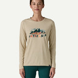 Woman wearing the Patagonia Women’s Long Sleeved Capilene Cool Daily Graphic Shirt in Fitz Roy Foliage, featuring the mountain graphic and Patagonia logo on the chest.