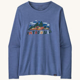 Front view of the Patagonia Women’s Long Sleeved Capilene Cool Daily Graphic Shirt in Fitz Roy Foliage Current Blue X-Dye, showing the mountain scene graphic and Patagonia logo on the chest.