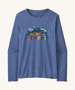 Front view of the Patagonia Women’s Long Sleeved Capilene Cool Daily Graphic Shirt in Fitz Roy Foliage Current Blue X-Dye, showing the mountain scene graphic and Patagonia logo on the chest.