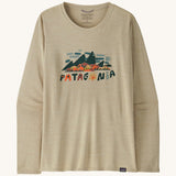 Front view of the Patagonia Women’s Long Sleeved Capilene Cool Daily Graphic Shirt in Fitz Roy Foliage Pumice X-Dye, showing the mountain scene graphic and Patagonia logo on the chest.
