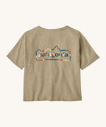 Patagonia women's unity Fitz roy responsibili tshirt. A light brown, short sleeved and boxy top with the brand logo printed on the front. 
