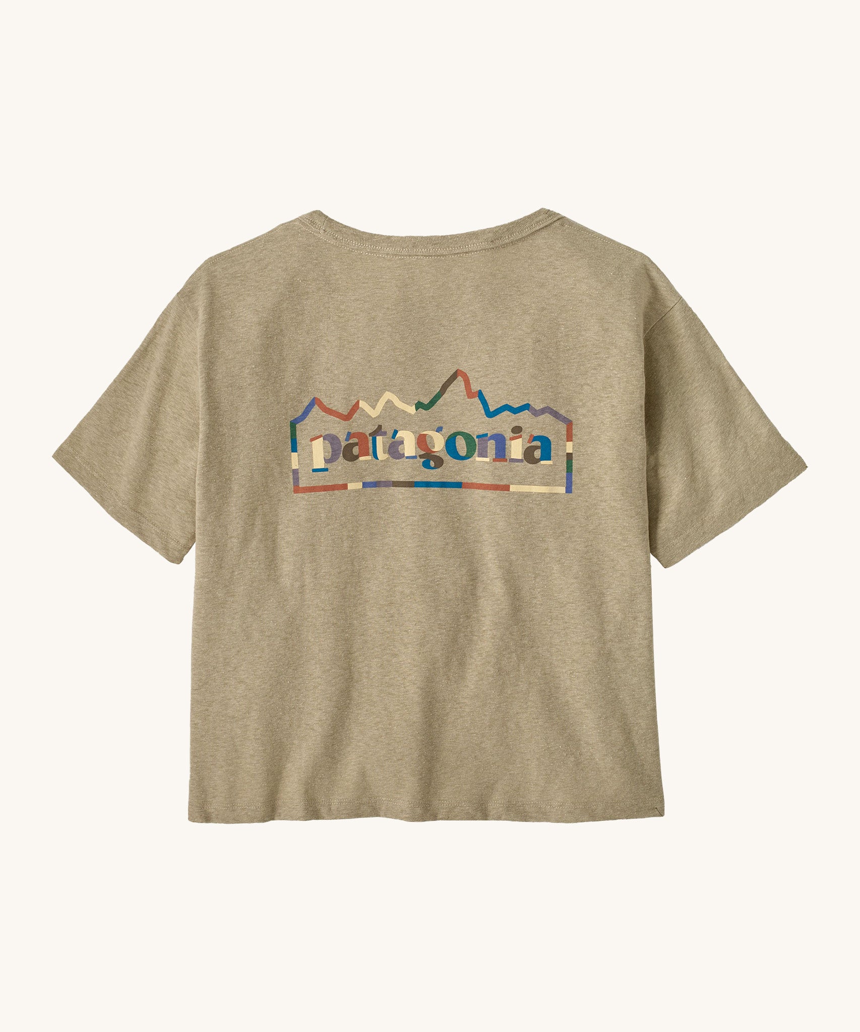 Patagonia women's unity Fitz roy responsibili tshirt. A light brown, short sleeved and boxy top with the brand logo printed on the front. 