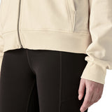 Close up of Woman wearing Patagonia's women's Anhya hoody Showing the ham sitting around the waist