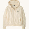 Patagonia women's Anhya hoody in cream. Shows a full length front zip and pouch pockets 