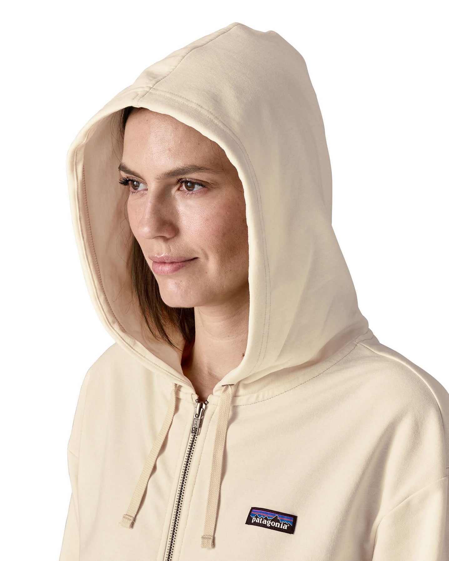 Close up of Woman wearing Patagonia's women's Anhya hoody Showing hood covering the whole head