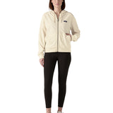 Woman wearing Patagonia's women's Anhya hoody with full front zip and a hand in the pouch pocket