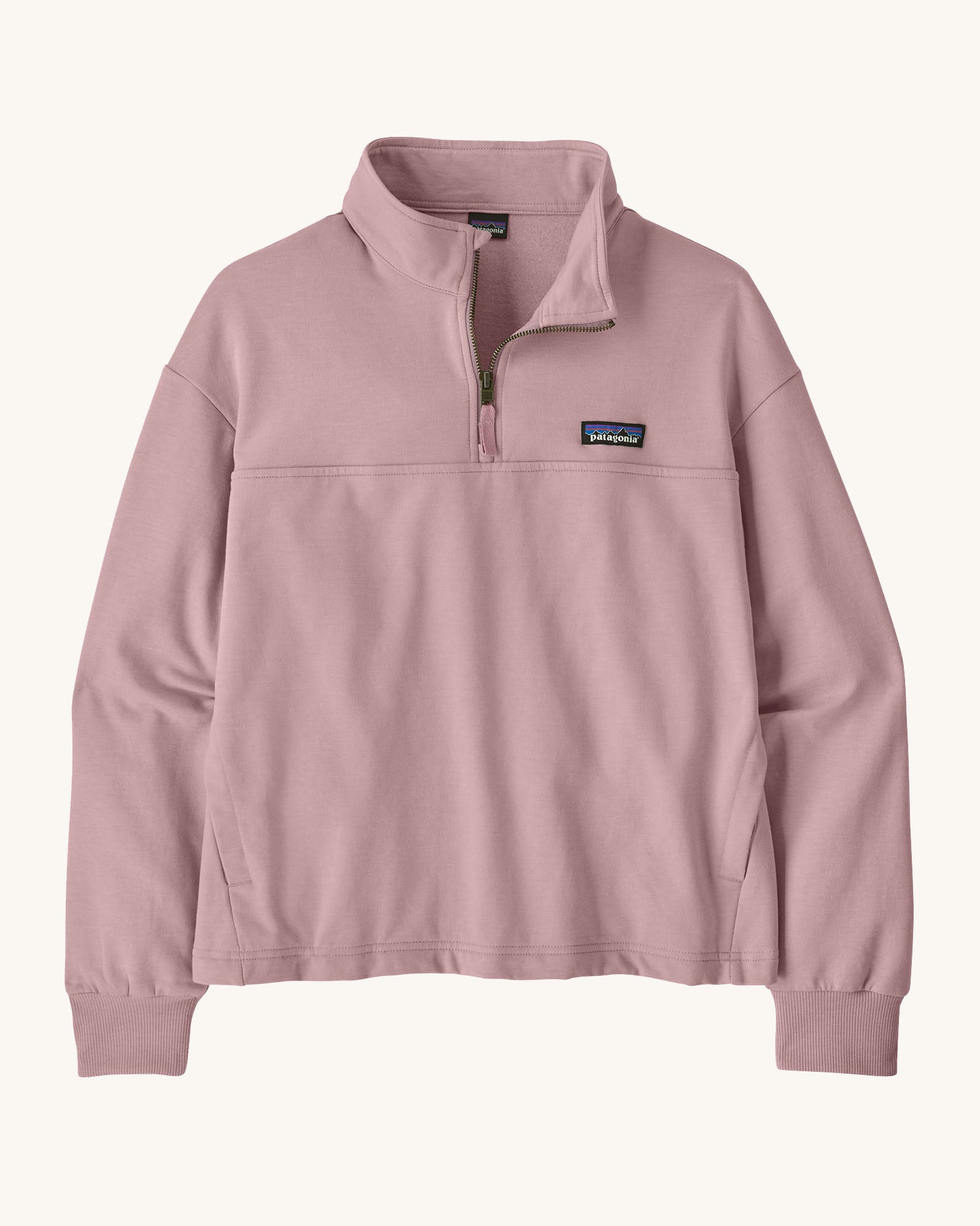 Patagonia women's Ahnya pullover sweater in pale purple. Shows a 1/4 length zip and side pockets
