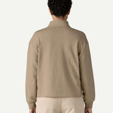 Back view of a woman wearing the Patagonia Women’s Ahnya Pullover in Seabird Grey, showing the relaxed boxy fit, long sleeves and rib knit cuffs.