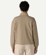 Back view of a woman wearing the Patagonia Women’s Ahnya Pullover in Seabird Grey, showing the relaxed boxy fit, long sleeves and rib knit cuffs.