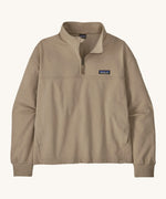 The women's Ahnya pullover jumper by Patagonia, in Seabird beige with a quarter zip. 