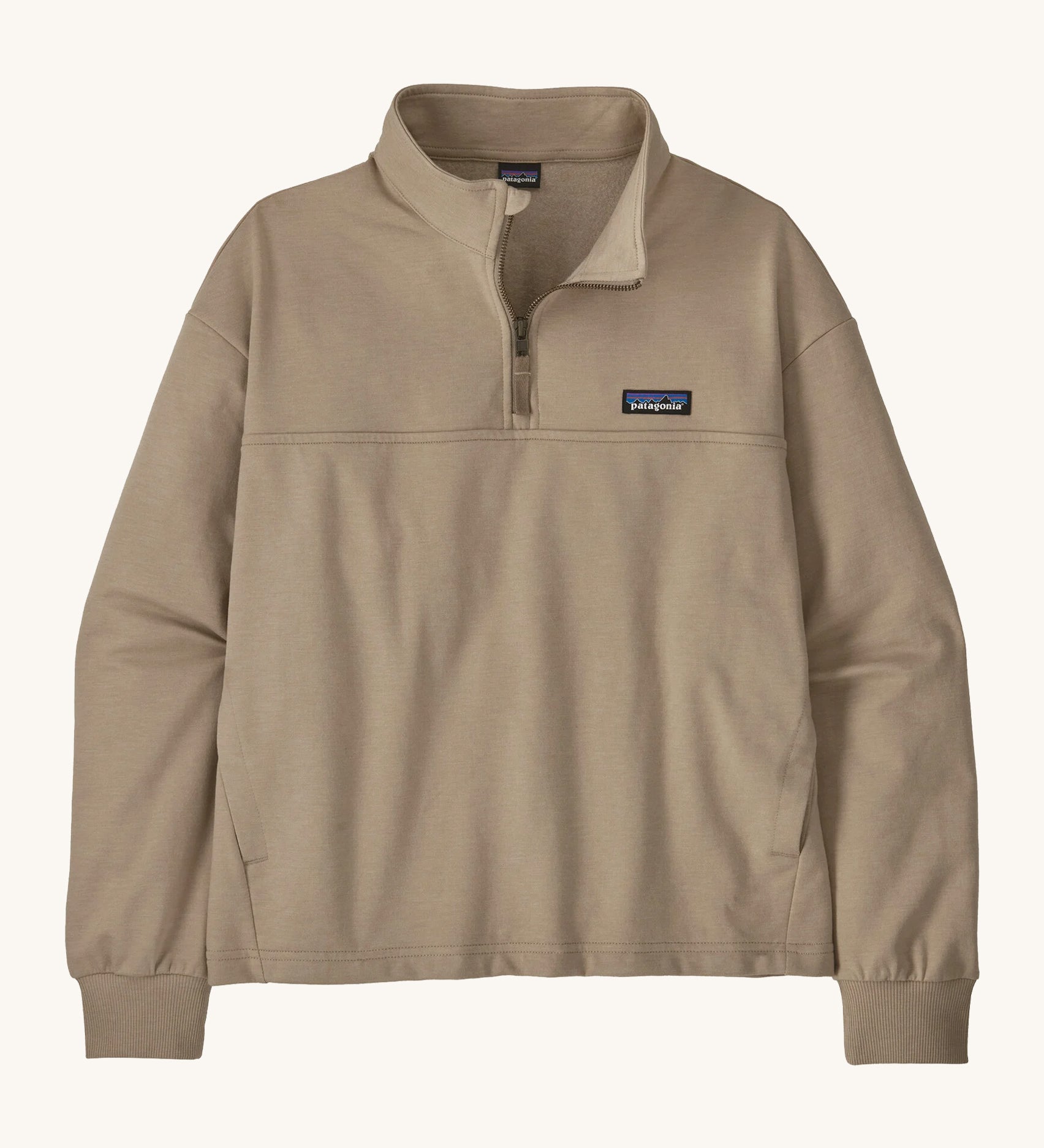 The women's Ahnya pullover jumper by Patagonia, in Seabird beige with a quarter zip. 
