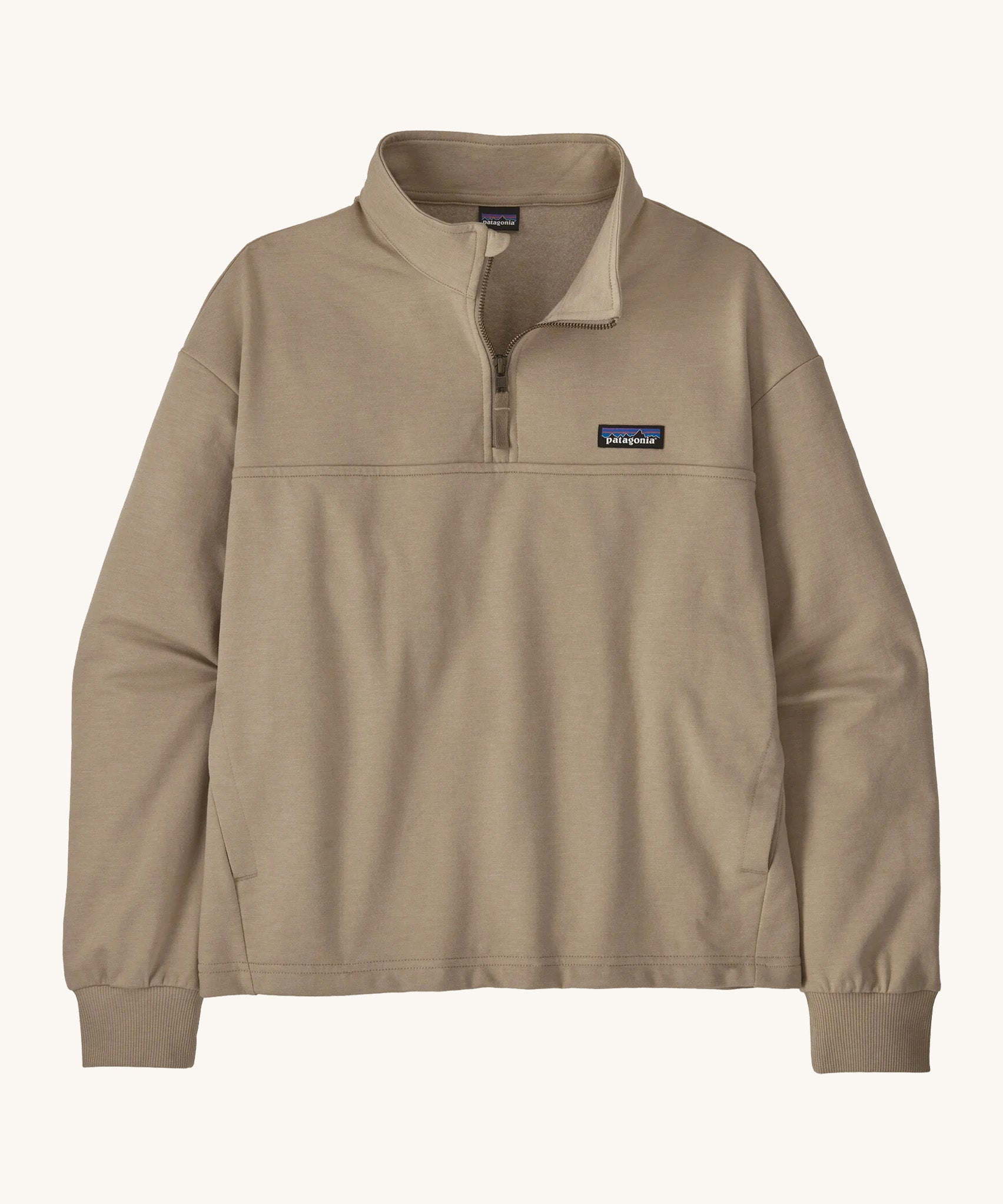 The women's Ahnya pullover jumper by Patagonia, in Seabird beige with a quarter zip. 