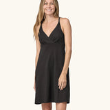 Front of woman wearing Patagonia's amber dawn organic cotton sleeveless dress in black.