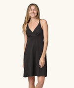 Front of woman wearing Patagonia's amber dawn organic cotton sleeveless dress in black.