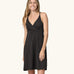 Front of woman wearing Patagonia's amber dawn organic cotton sleeveless dress in black.