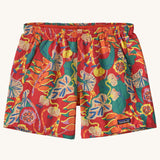Patagonia quick drying women's baggies shorts in red with repeating abstract tropical pattern. Showing 2 front pockets