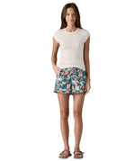 Woman Patagonia quick drying baggies shorts in blue with a repeating abstract design. Shorts have a relaxed fit