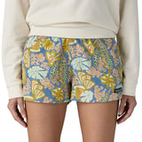 Front of woman wearing the Patagonia quick drying barely baggies shorts in blue with a repeating abstract floral design