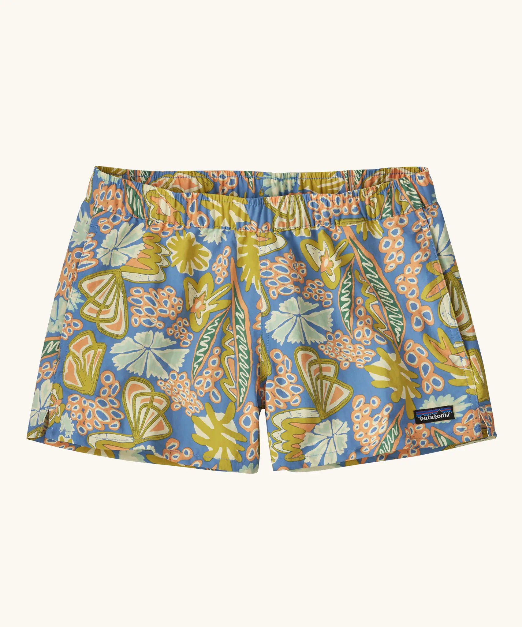 Patagonia quick drying women's barely baggies shorts in blue with a repeating abstract floral design. Shows 2 side pockets and elasticated waist band