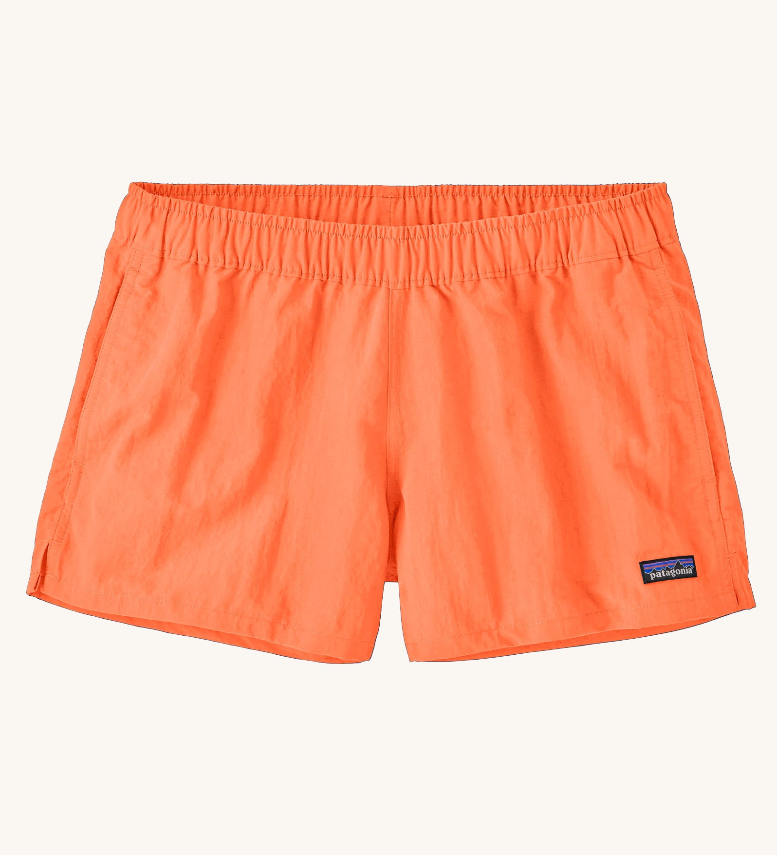 Patagonia quick drying women's barely baggies shorts in bright orange. Shows 2 side pockets and elasticated waist band