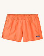 Patagonia quick drying women's barely baggies shorts in bright orange. Shows 2 side pockets and elasticated waist band