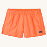 Patagonia quick drying women's barely baggies shorts in bright orange. Shows 2 side pockets and elasticated waist band