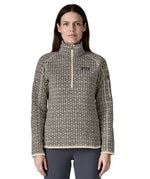 A woman wearing the Patagonia Women's Better Sweater 1/4 Zip in natural/scales available at Babipur. A thick sweater with a monochrome style print. 