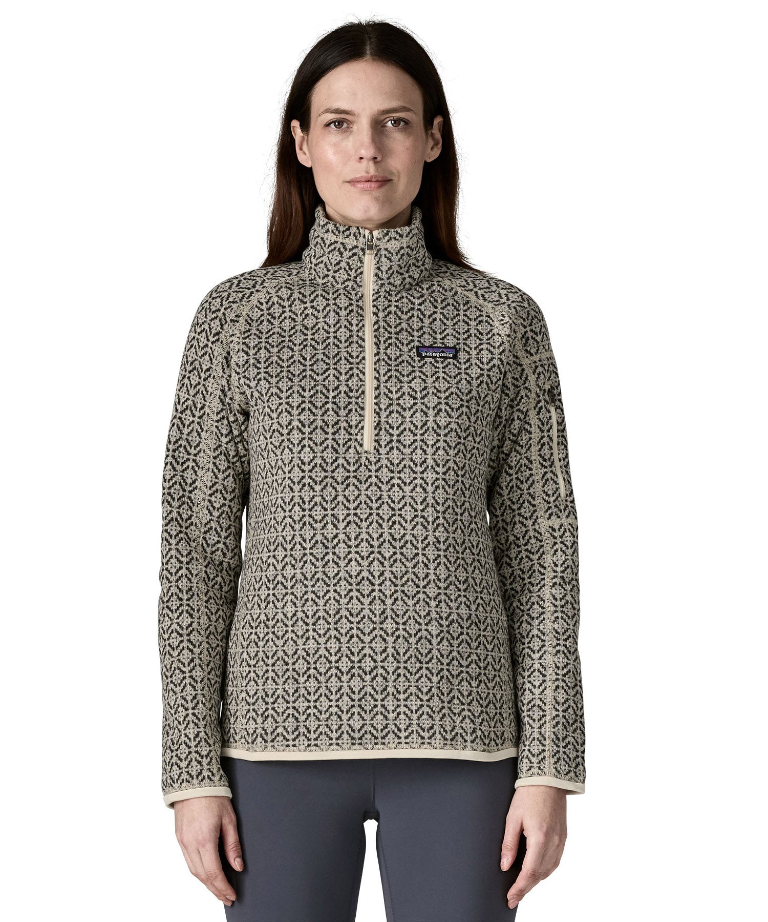 A woman wearing the Patagonia Women's Better Sweater 1/4 Zip in natural/scales available at Babipur. A thick sweater with a monochrome style print. 