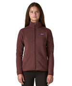 A woman wearing the Patagonia better sweater jacket in dark ruby available at Babipur. A light fleece style jacket in dark red colour. Features a full length zip with 2 side pockets and the logo patch stitched on the left chest. 