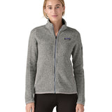 Woman wearing Patagonia's women's better sweater jacket in grey. Jacket has a regular fit and sits at the hips.
