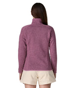 Back of woman wearing Patagonia's women's better sweater jacket in purple. The jacket has a regular fit 