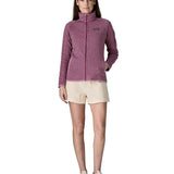 Back of woman wearing Patagonia's women's better sweater jacket in purple showing full length front zip. The jacket has a regular fit 